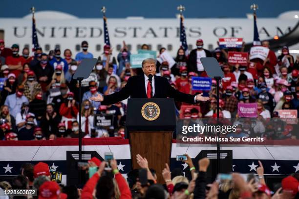 President Donald Trump addresses a crowd at the Fayetteville Regional Airport on September 19, 2020 in Fayetteville, North Carolina. Thousands of...