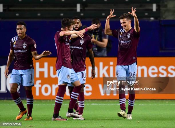 Cole Bassett is congratulated by Jonathan Lewis , Sam Vines and Kellyn Acosta of Colorado Rapids after scoring a goal in the first half of the game...