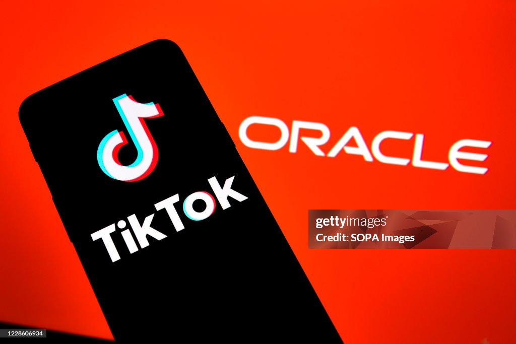 In this photo illustration a TikTok logo is seen displayed...