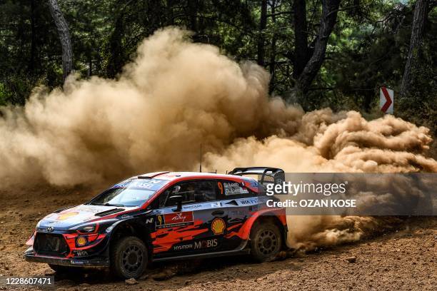 French driver Sebastien Loeb and co-driver Daniel Elena steer their Hyundai i20 coupe WRC racing car during the marmaris stage on the third and last...
