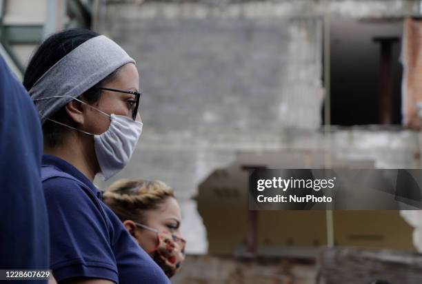 Rescuers and paramedics stood guard outside the Rébsamen School in Mexico City, in memory of the children who died after a building collapsed during...