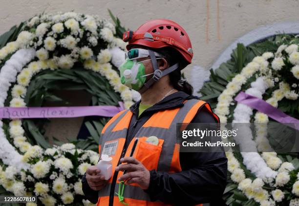 Rescuer carries out a guard in memory of the girls and boys who died at the Rébsamen School in Mexico City after a building collapsed during the...