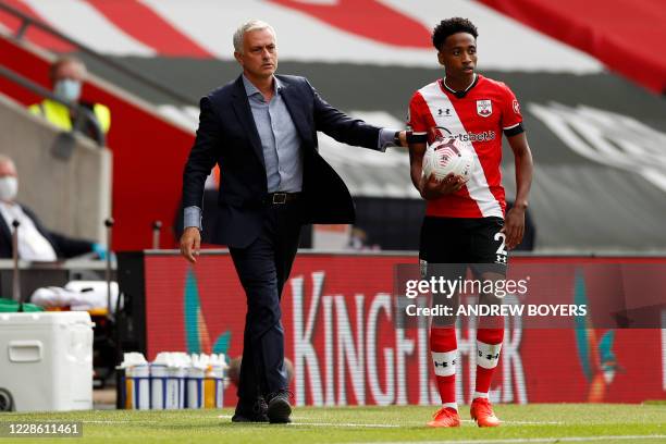 Tottenham Hotspur's Portuguese head coach Jose Mourinho gestures as Southampton's English defender Kyle Walker-Peters waits to take a throw-in during...