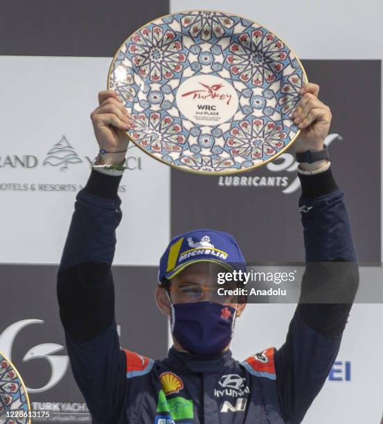 Thierry Neuville of Hyundai Shell Mobis World Rally poses with his award after come second in the 5th leg of the World Rally Championship in Mugla,...