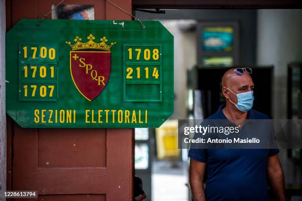 Man leaves the polling station after voting in the constitutional referendum in the high school "Liceo Virgilio" on September 20, 2020 in Rome,...