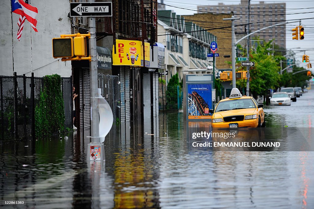 A taxi sits in flood water on Coney Isla