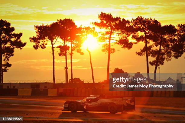 The Toyota Gazoo Racing TS050 Hybrid of Sebastien Buemi, Kazuki Nakajima, and Brendon Hartley in action at sunrise at the Circuit de la Sarthe on...