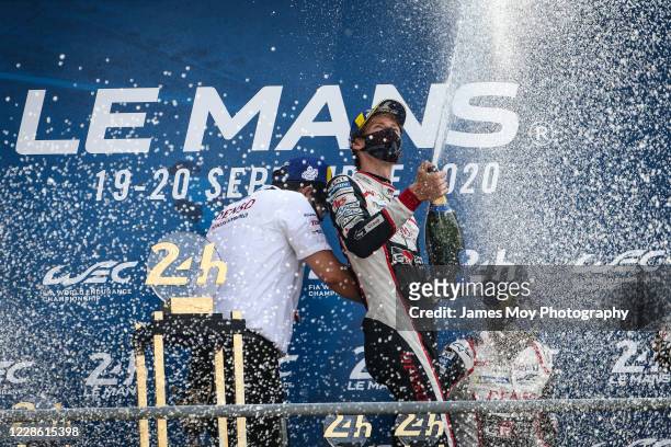 Race winner Brendon Hartley of New Zealand and Toyota Gazoo Racing, celebrates on the podium at the Circuit de la Sarthe on September 20, 2020 in Le...