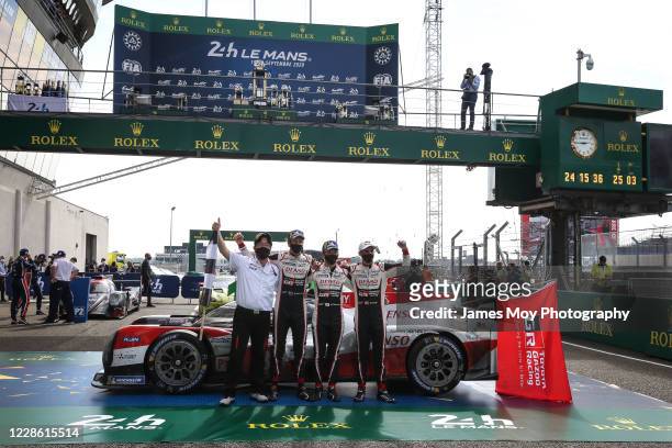 Race winners Brendon Hartley of New Zealand, Kazuki Nakajima of Japan and Sebastien Buemi of Switzerland, celebrate victory for the Toyota Gazoo...