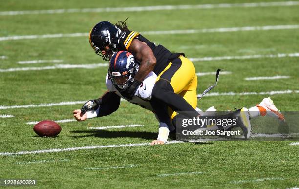 Bud Dupree of the Pittsburgh Steelers forces a fumble after hitting Drew Lock of the Denver Broncos during the first quarter at Heinz Field on...