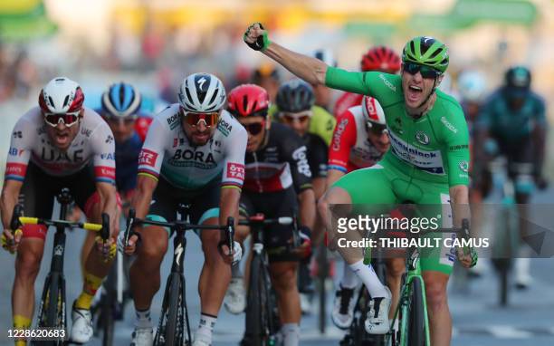Stage winner Team Deceuninck rider Ireland's Sam Bennett wearing the best sprinter's green jersey celebrates as he crosses the finish line during the...