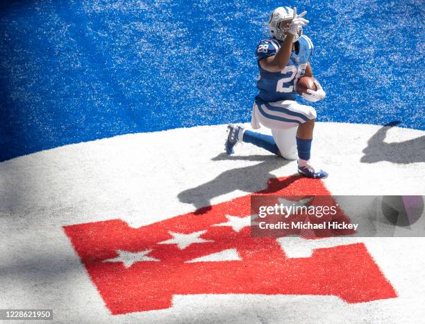 Jonathan Taylor of the Indianapolis Colts reacts after a touchdown during the first half against the Minnesota Vikings at Lucas Oil Stadium on...