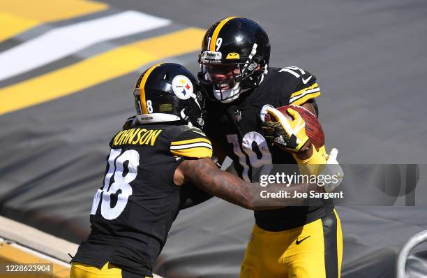 Diontae Johnson celebrates his touchdown with JuJu Smith-Schuster of the Pittsburgh Steelers during the fourth quarter against the Denver Broncos at...