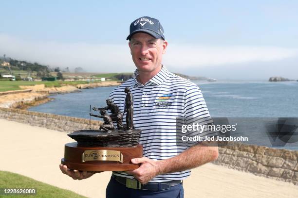 Jim Furyk celebrates with the trophy after winning the final round of the PURE Insurance Championship at the Pebble Beach Golf Links on September 20,...