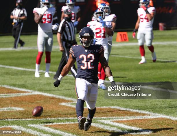 Chicago Bears running back David Montgomery celebrates after rushing for a touchdown in the first quarter against the New York Giants on Sunday,...