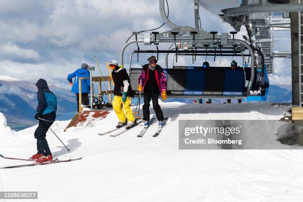 People disembark a chairlift at the Coronet Peak ski field near Queenstown, New Zealand, on Thursday, Sept. 10, 2020. In a normal year, international...