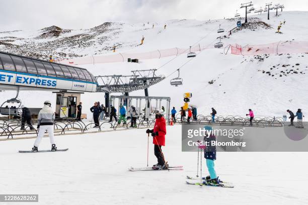 People ski near the chairlift at the Coronet Peak ski field near Queenstown, New Zealand, on Thursday, Sept. 10, 2020. In a normal year,...