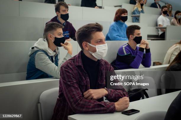 Student wearing a face mask as a precaution. High school students from various schools in Tambov at an additional lesson and practical seminar on...
