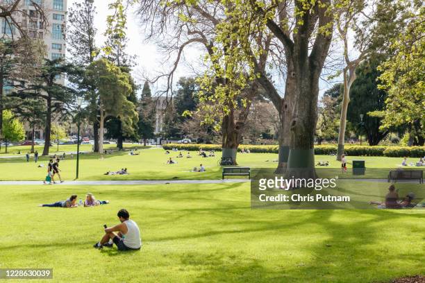 People relax in Carlton Gardens as allowed time outside is increased during the Coronavirus pandemic and associated lockdown.- PHOTOGRAPH BY Chris...