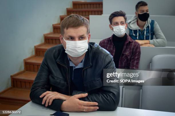 Student wearing a face mask as a precaution. High school students from various schools in Tambov at an additional lesson and practical seminar on...