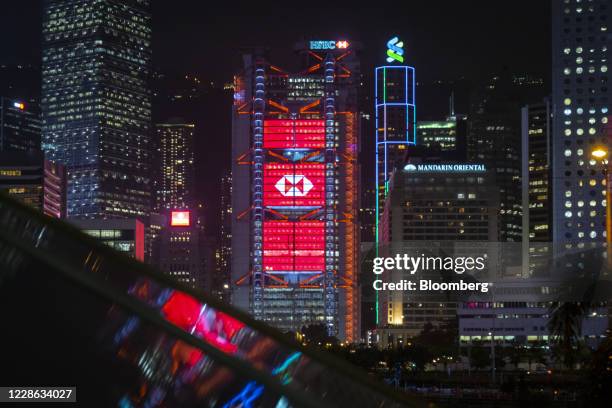 The HSBC Holdings Plc headquarters building stands illuminated in Hong Kong, China, on Monday, Sept. 21, 2020. HSBC slumped below its financial...