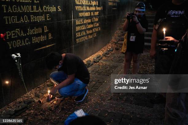 Filipino journalists gathered at the Monument of Heroes to offer prayers and flowers to fallen colleagues on the anniversary of Martial Law in the...