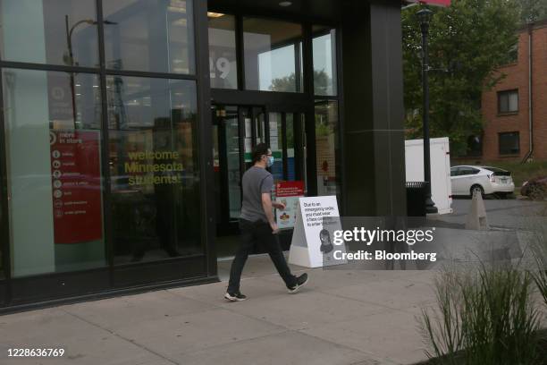 Sign outside of a Target Corp. Store notifies customers they must wear masks on the University of Minnesota campus in Minneapolis, Minnesota, U.S.,...