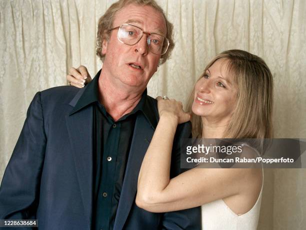 Michael Caine and Barbra Streisand pose together backstage at Streisand's concert at Wembley Arena in London, England on 20 April 1994.