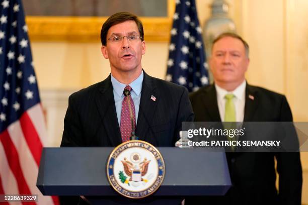 Defense Secretary Mark Esper speaks during a news conference as US Secretary of State Mike Pompeo listens during the announcement of the Trump...