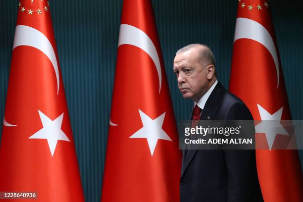 President of Turkey, Recep Tayyip Erdogan arrives to give a press conference after the cabinet meeting at the Presidential Complex in Ankara, Turkey,...