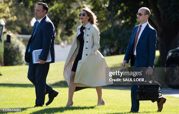 Dan Scavino , Director of White House Social Media, Hope Hicks, White House counselor, and Stephen Miller , White House senior advisor, walk to...