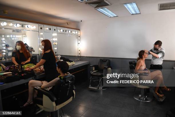 Miss Venezuela beauty pageant contestants get ready in the dressing room before a meeting with judges, at the Venevision television station, in...