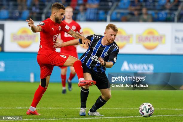 Sead Hajrovic of Viktoria Koeln and Dominik Martinovic of Waldhof Mannheim during the 3. Liga match between SV Waldhof Mannheim and FC Viktoria Koeln...