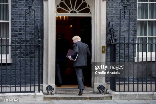 Britain's Prime Minister Boris Johnson walks into Downing Street after of a cabinet meeting at the FCO on September 22, 2020 in London, England....