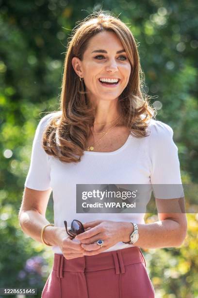 Catherine, Duchess of Cambridge meets with MUSH mother and baby group member, Morgan Alex Cassius and her 6 month old, Makena Grace as she hears from...