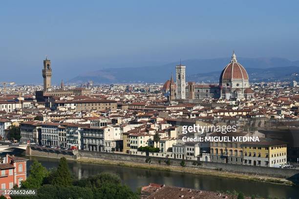 Picture taken on September 14, 2020 shows the Palazzo Vecchio , the Giotto bell tower or the Bell tower, the Santa Maria del Fiore Cathedral or Duomo...