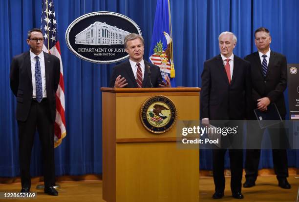 Director Christopher Wray speaks as Deputy Attorney General Jeffrey A. Rosen , Drug Enforcement Agency acting Administrator Timothy Shea and...