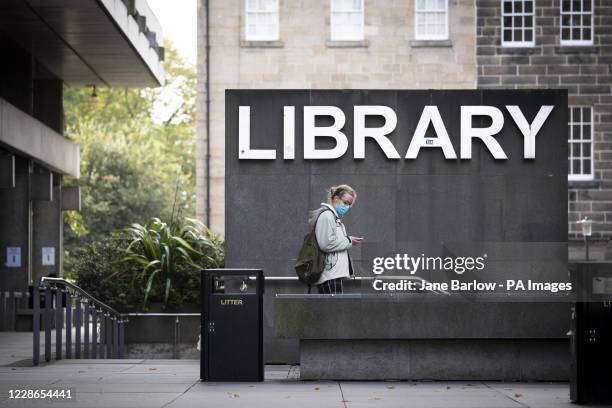 Student wearing a protective face mask outside the main library at the University of Edinburgh in George Square, Edinburgh, after First Minister...