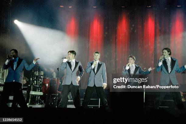 British boy band Take That Jason Orange, Robbie Williams, Gary Barlow, Mark Owen and Howard Donald performing during "The Party Tour" at Hylands Park...