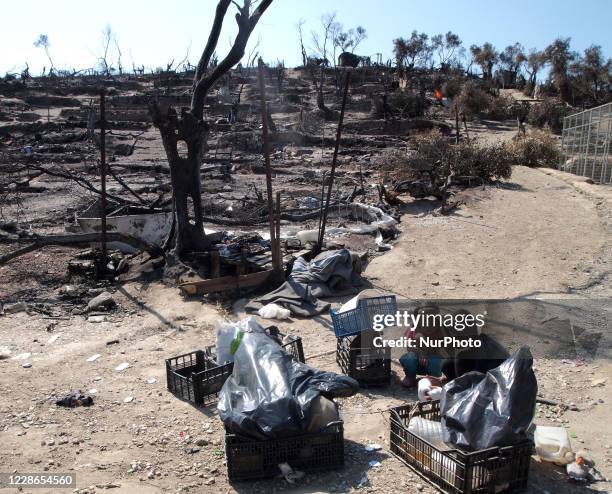 Refugees in Moria camp after a fire destroyed the camp, leaving many refugees and migrants homeless on the Greek island of Lesbos, on September 22,...