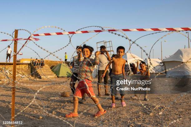 The Covid-19 quarantine area with fences made of barbed wire for the Coronavirus positive cases in the new refugee camp in Kara Tepe - Mavrovouni a...