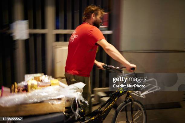 Taron has finished for this night and came back to his apartment with his bicycle full of products.Tarin, a young man, searches for food in trash...