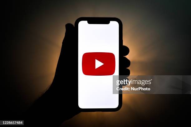YouTube logo is seen displayed on a phone screen in this illustration photo taken on September 22, 2020 in Krakow, Poland. YouTube introduced YouTube...