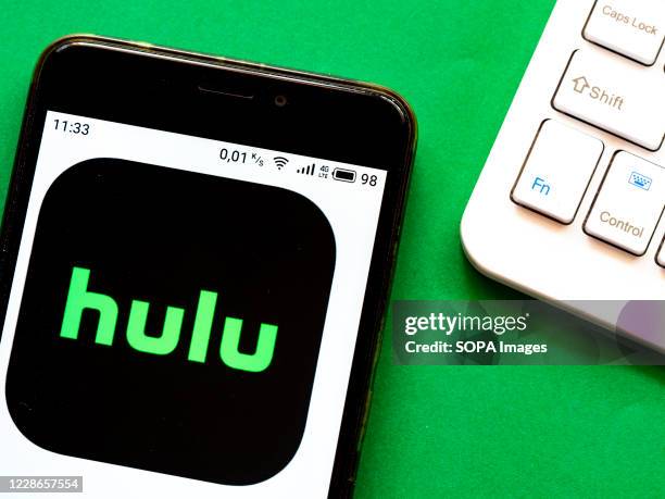 In this photo illustration a Hulu logo seen displayed on a smartphone.