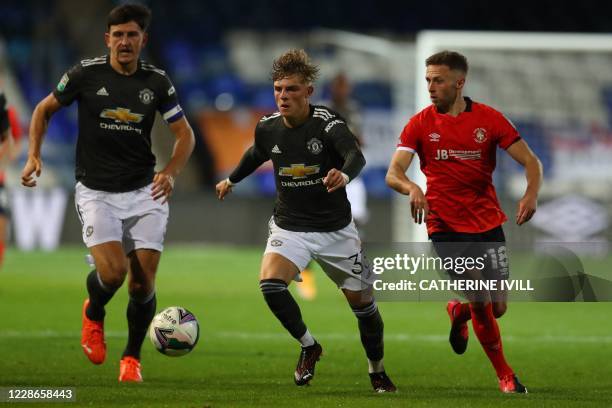 Manchester United's English defender Brandon Williams controls the ball during the English League Cup third round football match between Luton Town...