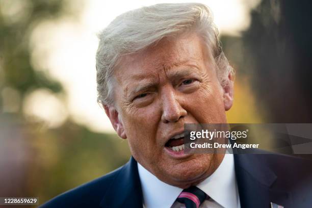 President Donald Trump stops and takes questions from reporters on his way to Marine One on the South Lawn of the White House on September 22, 2020...