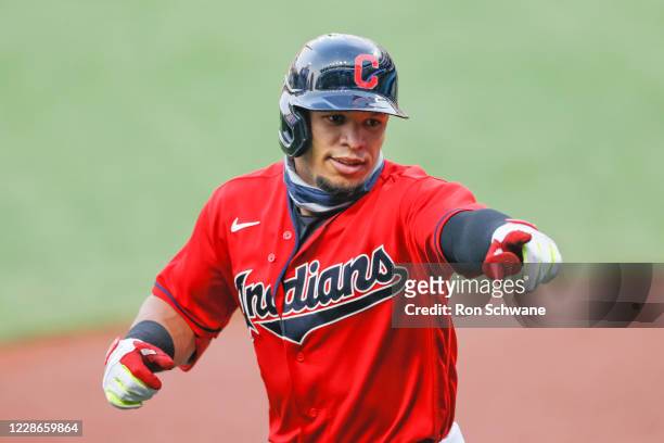 Cesar Hernandez of the Cleveland Indians celebrates after hitting a solo home run off Reynaldo López of the Chicago White Sox during the first inning...