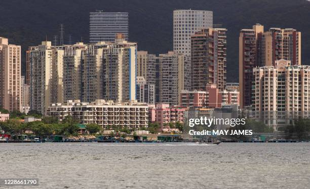 This picture taken on September 19, 2020 from across the water in Hong Kong shows a view of the skyline of Yantian, a district in the neighbouring...