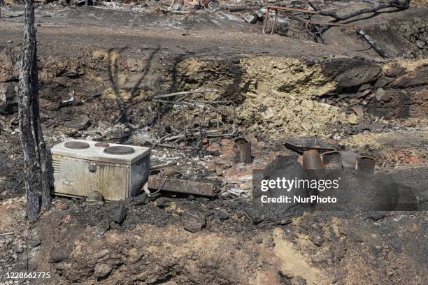 The aftermath of the fire in Moria Refugee camp and the nearby olive groves. Migrants and refugees are looking for their belongings or searching for...