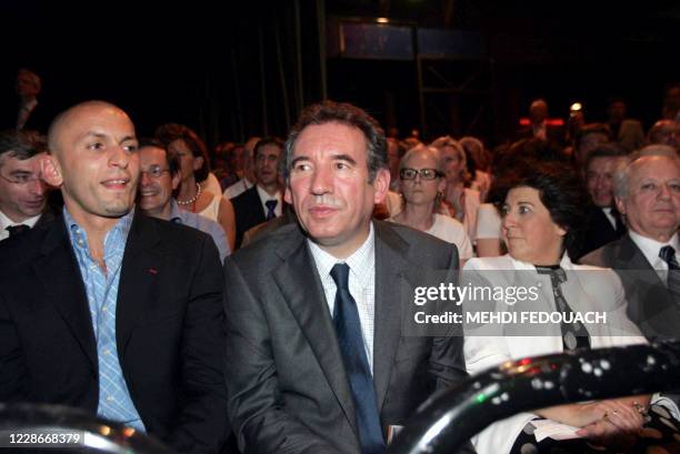 French leader of newly launched Democratic Movement party , Francois Bayrou , sits next to French judoka Djamel Bouras , Former ecology minister,...